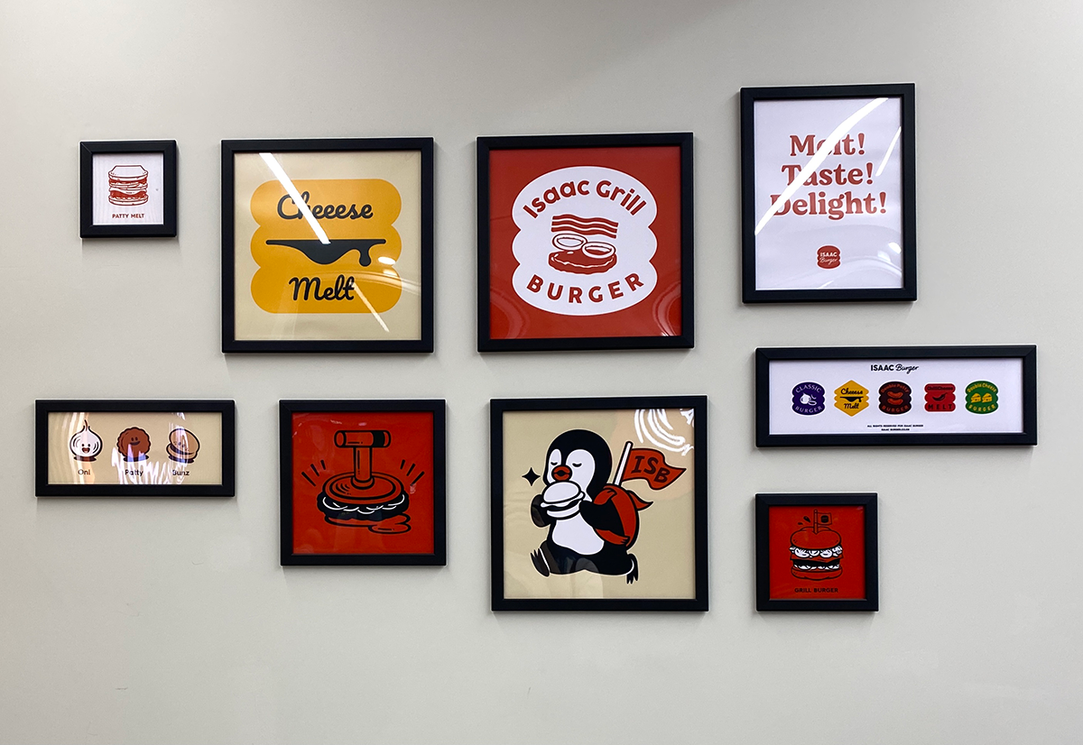 paintings on the wall at ISAAC Burger