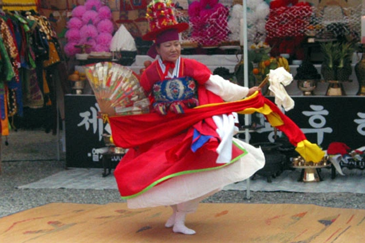 Korean shaman, mudang, performing a rite
