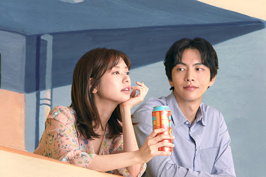 Woman with a canned drink next to a man