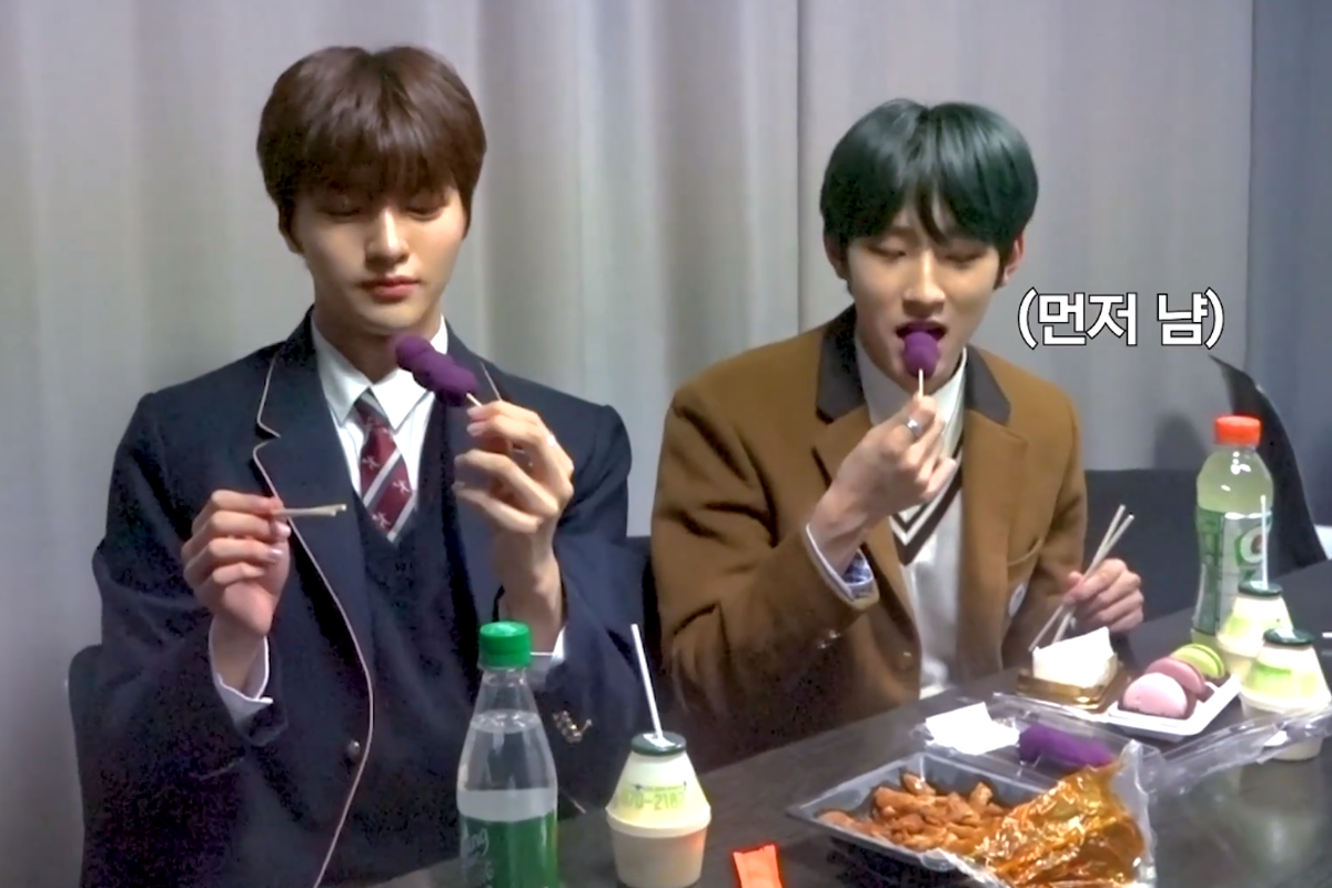 Minseo and Junho of Drippin eating sweet potato skewers