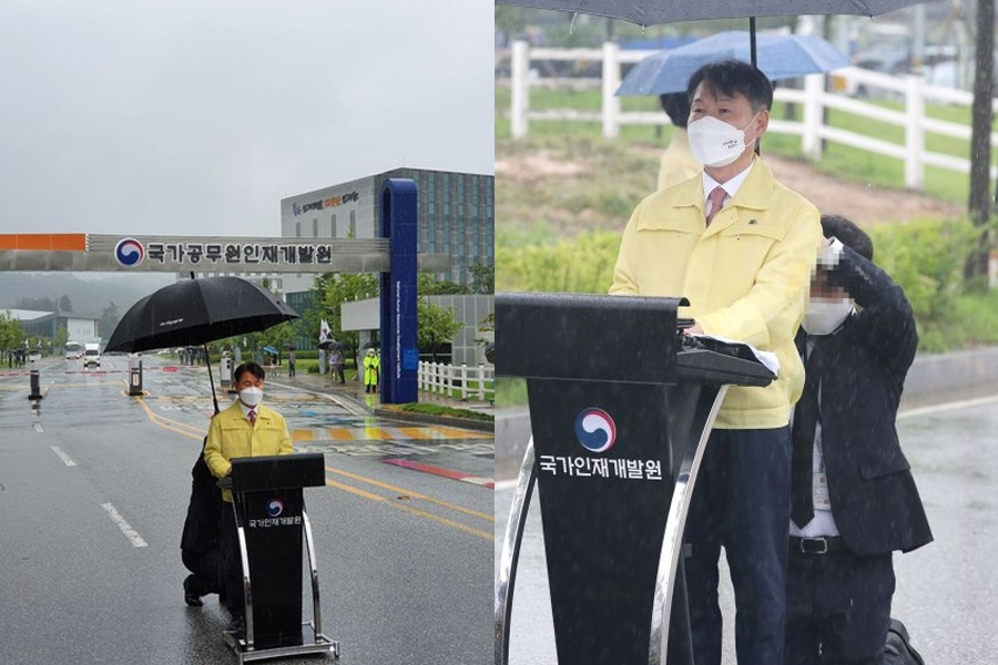 韩国法务部官员在雨中发言，职员为其撑伞，照片揭露职位礼仪过剩问题，引发公众热议。