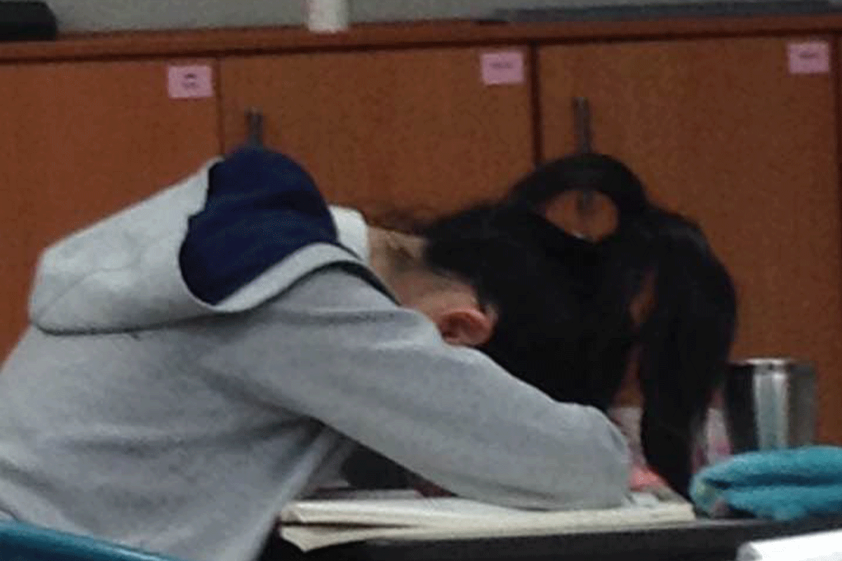 Korean student sleeping at their desk