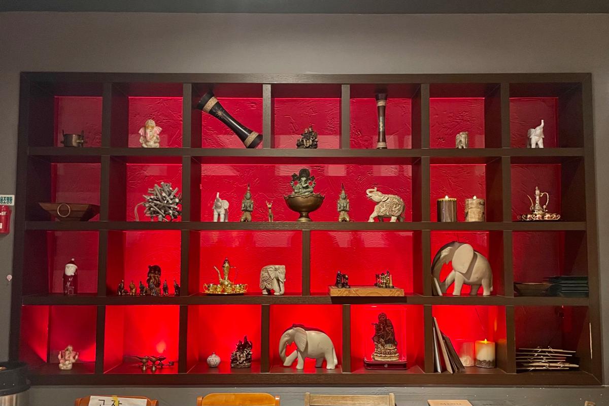 The Masala in Myeongdong shelves with Indian decor