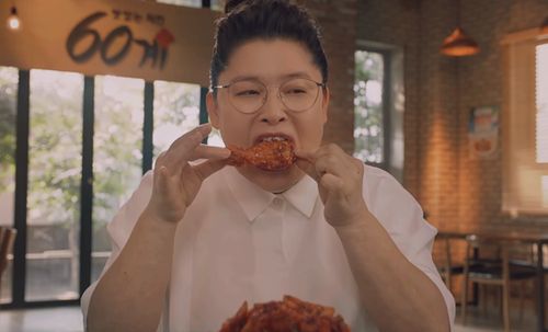 The History Of Korean Fried Chicken - person eating chicken