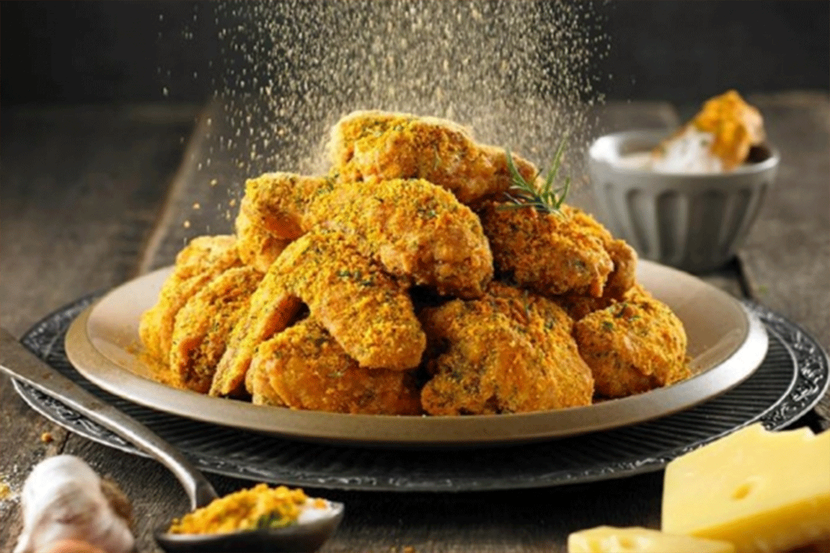 The History Of Korean Fried Chicken: seasoning chicken
