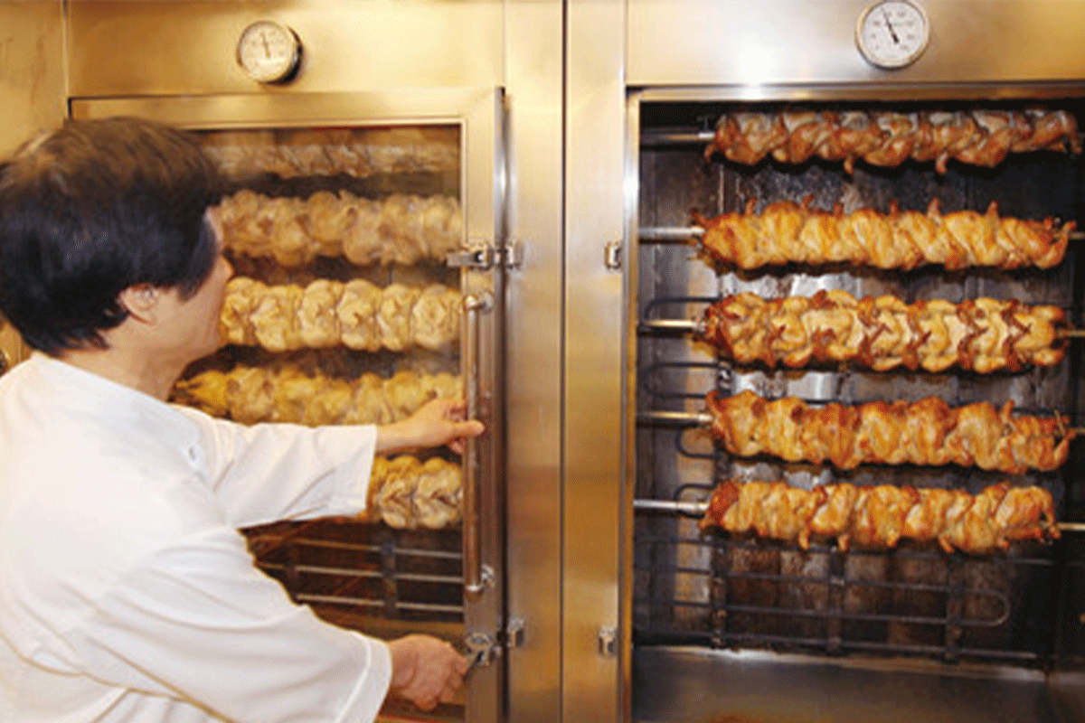 The History Of Korean Fried Chicken: chickens roasting