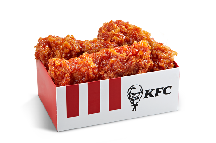 KFCの韓国限定ヤンニョムチキン、箱に入った3ピースが見える。韓国特有の甘辛ソースで味付けされたフライドチキン。