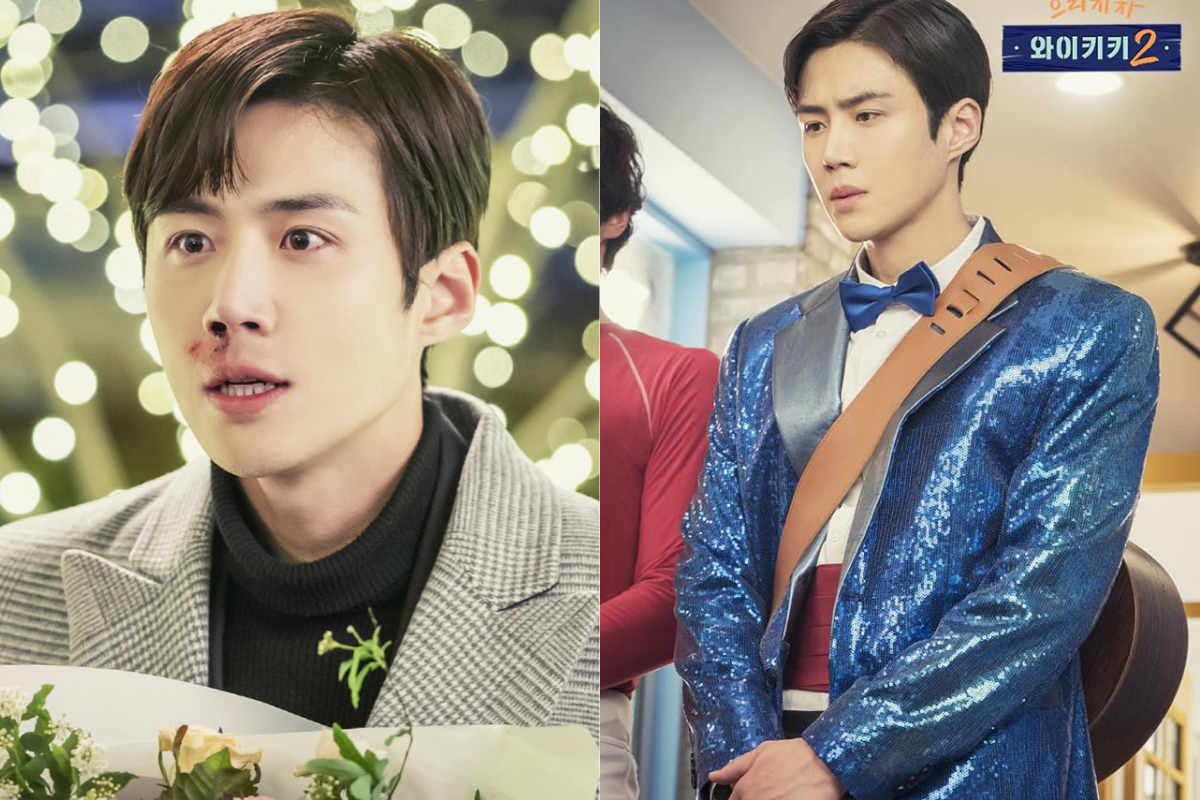 Ким Сон Хо в сериале 'Добро пожаловать в Вайкики 2', персонаж в ярком голубом костюме с гитарой на фоне праздничных огней, 2019 год