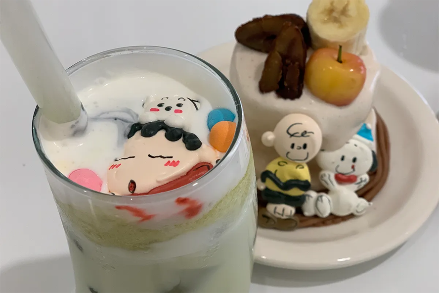busan korea gwangalli beach cafe, the same age couple, cute cartoon drink