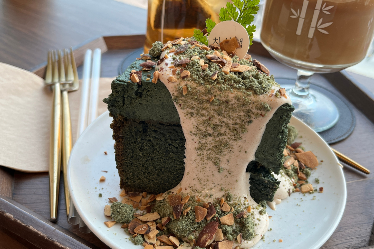 Delicious mugwort gateau cake topped with cream and nuts at Chasunchaek cafe in Busan.