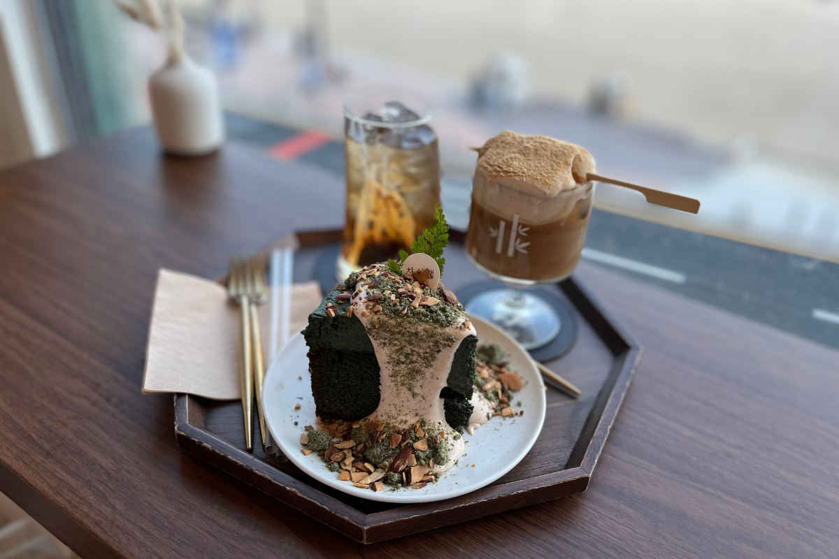 Close-up of mugwort gateau cake with nuts and cream at Chasunchaek cafe, Busan.