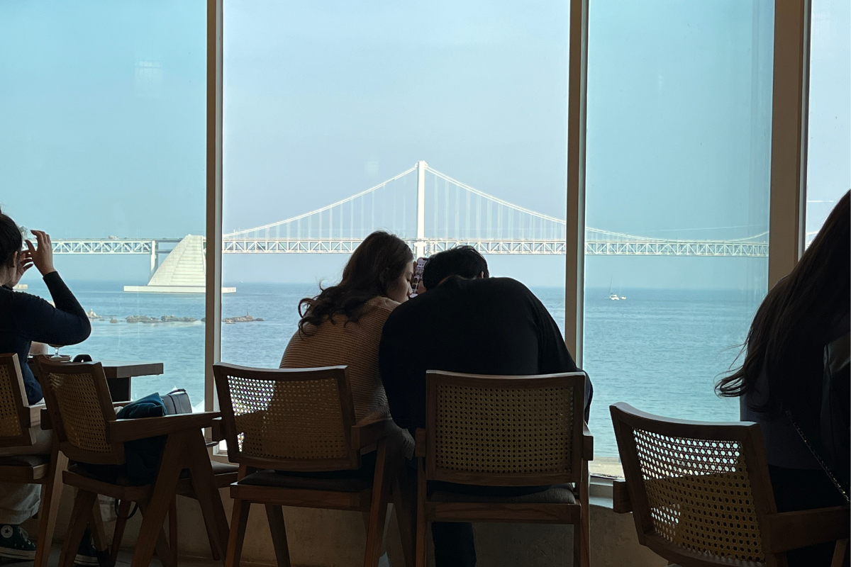 A serene view of Gwangan Bridge from the window seating area of Chasunchaek cafe in Busan.