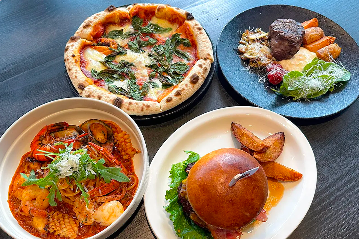 大满月餐厅多款西式美食拼盘，包括披萨、意大利面等，呈现精致的视觉美感与口感多样性。