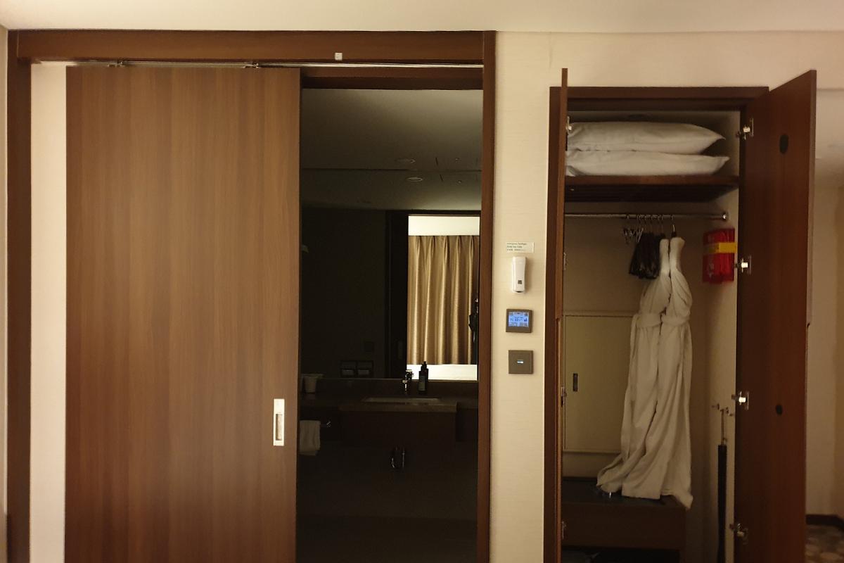 The side of the room shows the closet and entrance to the bathroom.