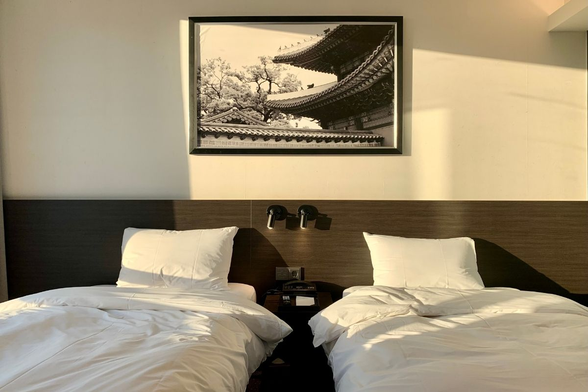 A view of our beds and night stand.