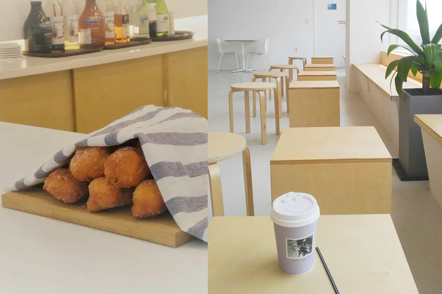 Freshly baked pastries and a coffee cup set against the clean, minimalistic decor of wknd lounge cafe in Incheon.