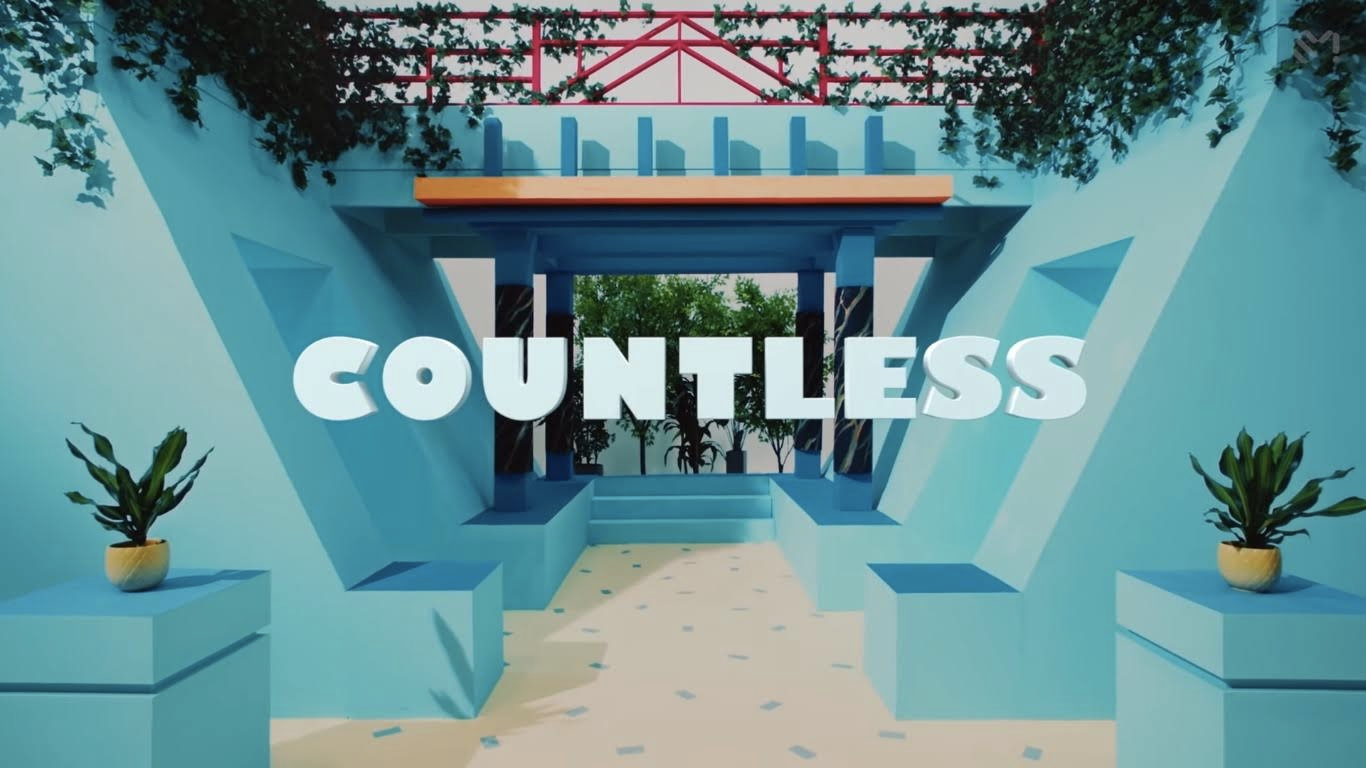 韩国男团SHINee的单曲《Countless》的MV中展示了一个装饰性场景，蓝色建筑环绕着绿色植物，前景中显示歌曲名称。