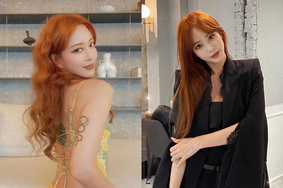 名人展示亮眼的紅橙髮色造型，背景為時尚室內裝潢。