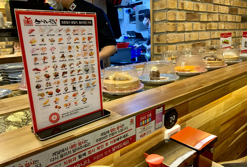 Sushi Nokando壽司店內的壽司菜單展示牌，顯示所有可供選擇的壽司品種。