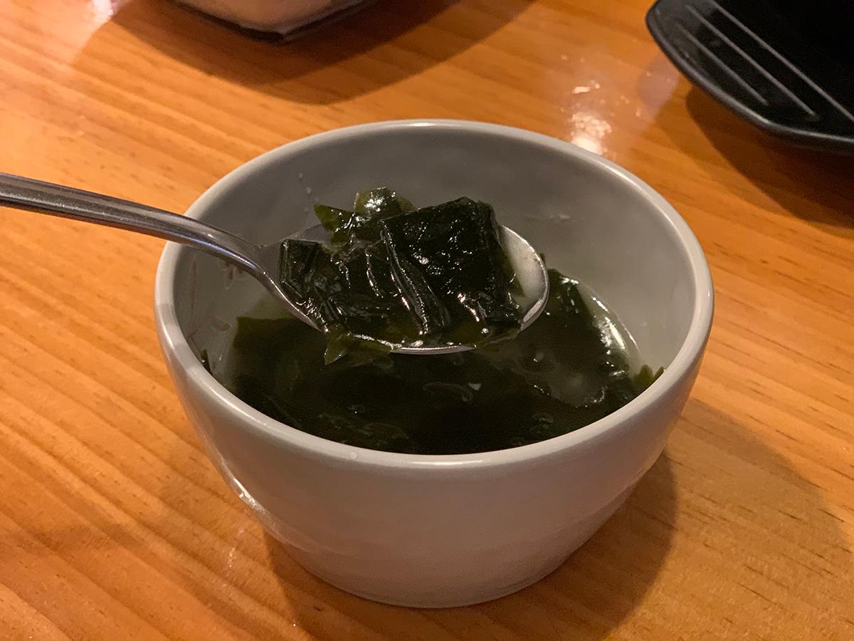 The seaweed soup that was served with the meal.