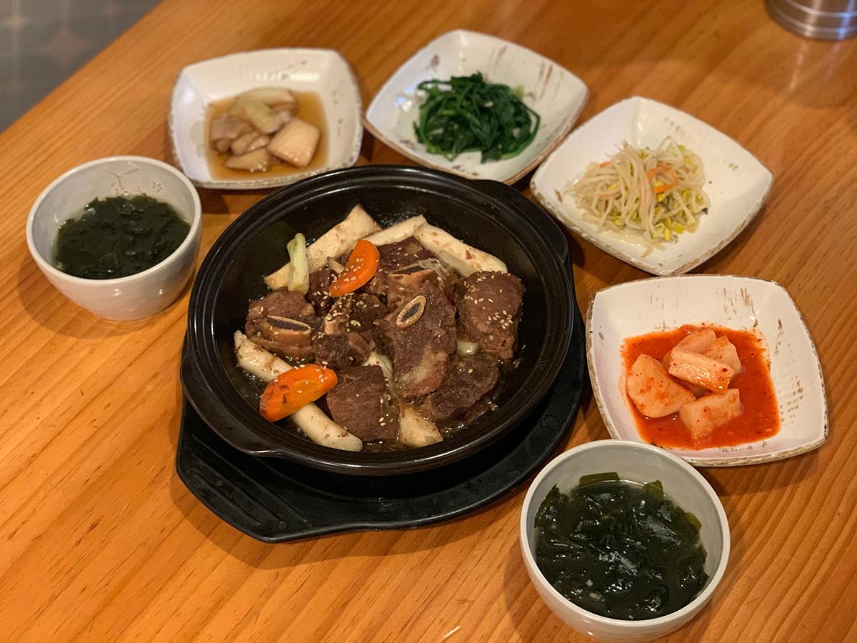 The short ribs dish with all the served side dishes.