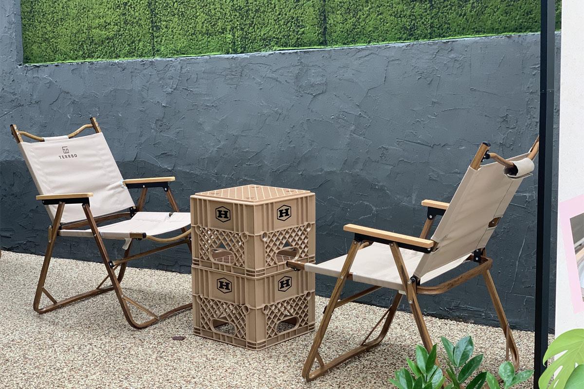 A set of camping chairs and table on the terrace.