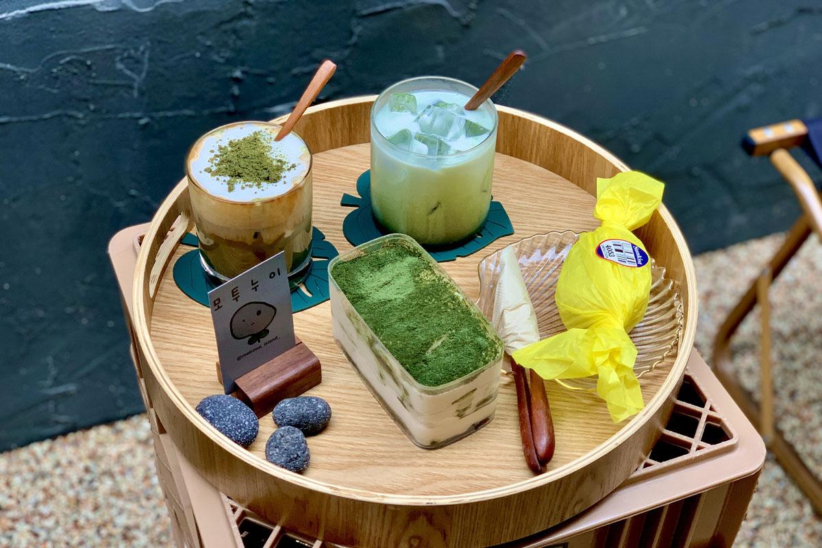 Our order which consisted of the Nui Latte, Mugwort Latte, Lemon Cake, and Mugwort Jeolmi Tiramisu.