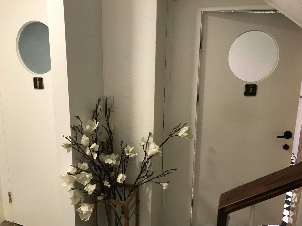 The entrance to the clean and simply decorated bathroom.