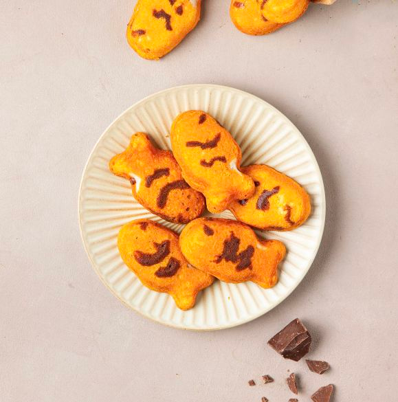 Empaque de Orion Hotteok en forma de pez (8 paquetes) con gráficos de tortas de hotteok.