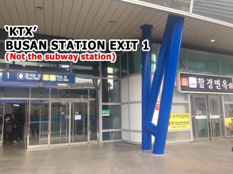 Entrance of KTX Busan Station Exit 1 with Korean signs and a glass facade.