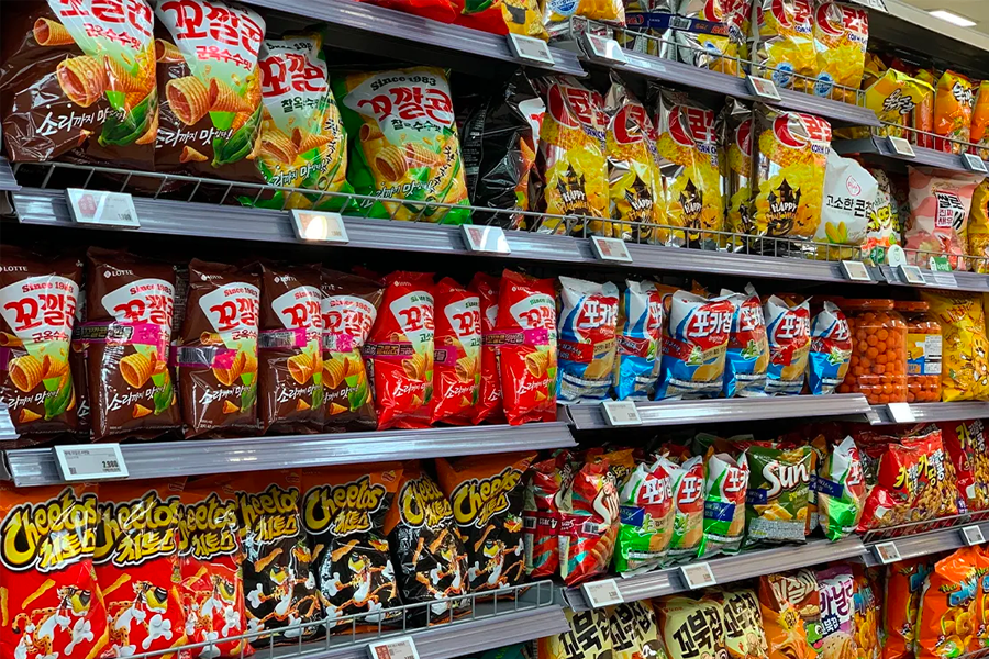 Interior snapshot of Lotte Mart showcasing an assortment of snacks, illustrating the variety of products available to shoppers.