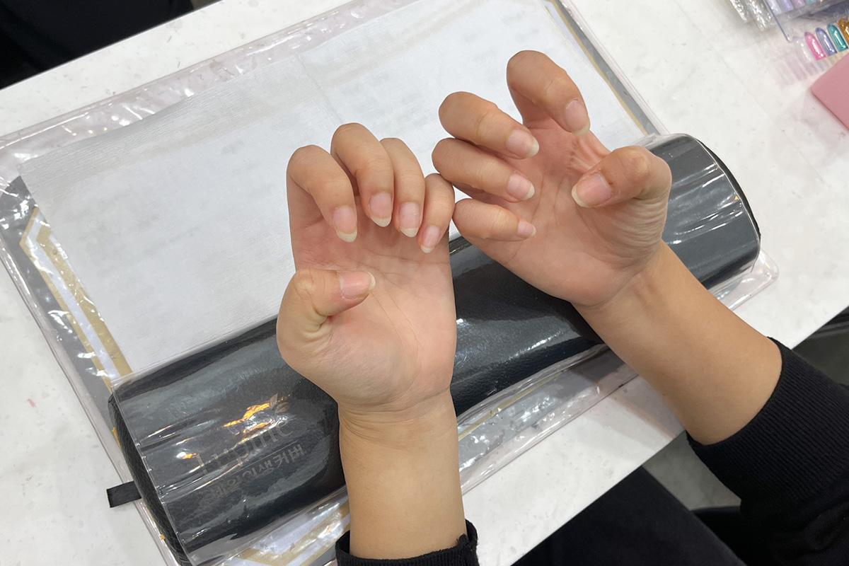 Hands before receiving nail treatment at Ohneulgwa Dareun Nail Salon, ready for a manicure transformation.