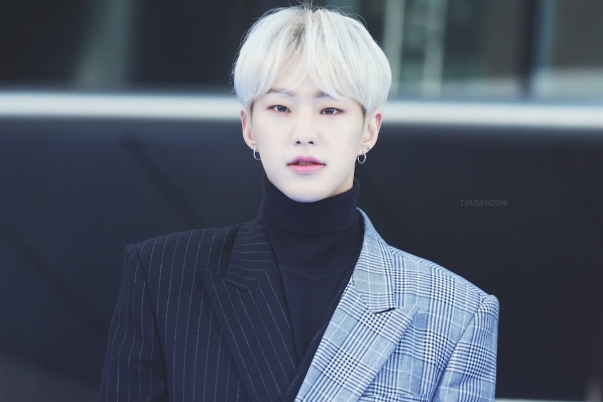 SEVENTEEN's Joshua with platinum blonde hair, a bold and trendy color choice.