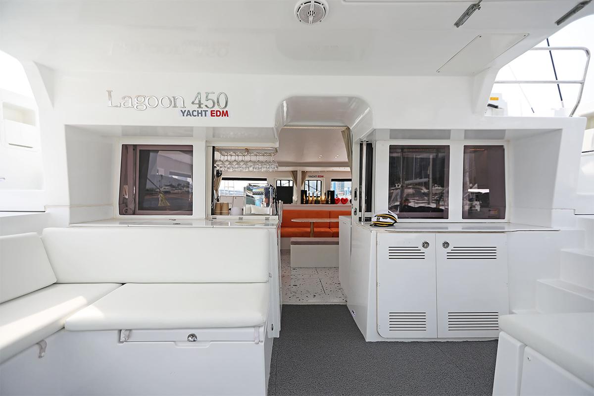 Spacious interior of a luxury yacht with seating area and a stylish design.