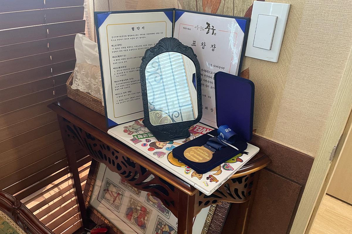 Decorative awards and medals displayed as a testament to Happy Skin Myeongdong Spa's service excellence.