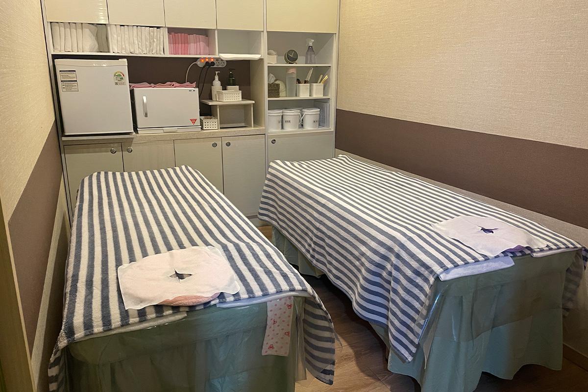 Foot massage area providing comfortable treatments at Happy Skin Myeongdong Spa.