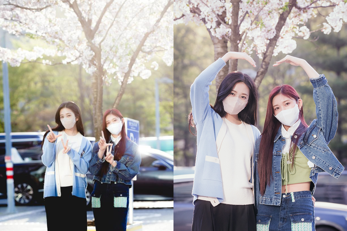 IVE's An Yujin and Leeseo posing with cherry blossoms, capturing a moment of elegance and style on their way to a radio broadcast.