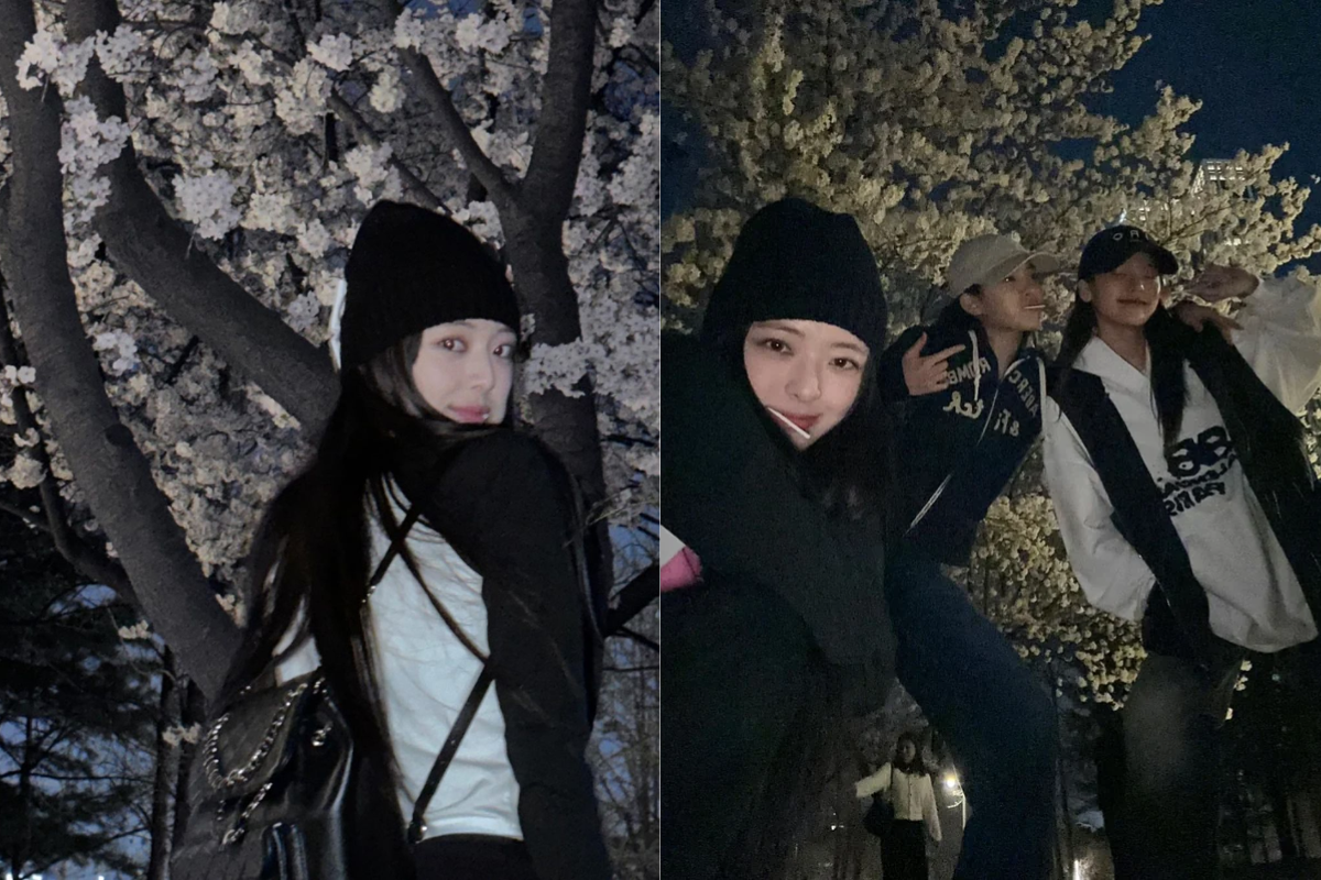 ITZY's Yuna, Ryujin, and Yeji having fun under cherry blossoms at night at Seokchon Lake in Korea.