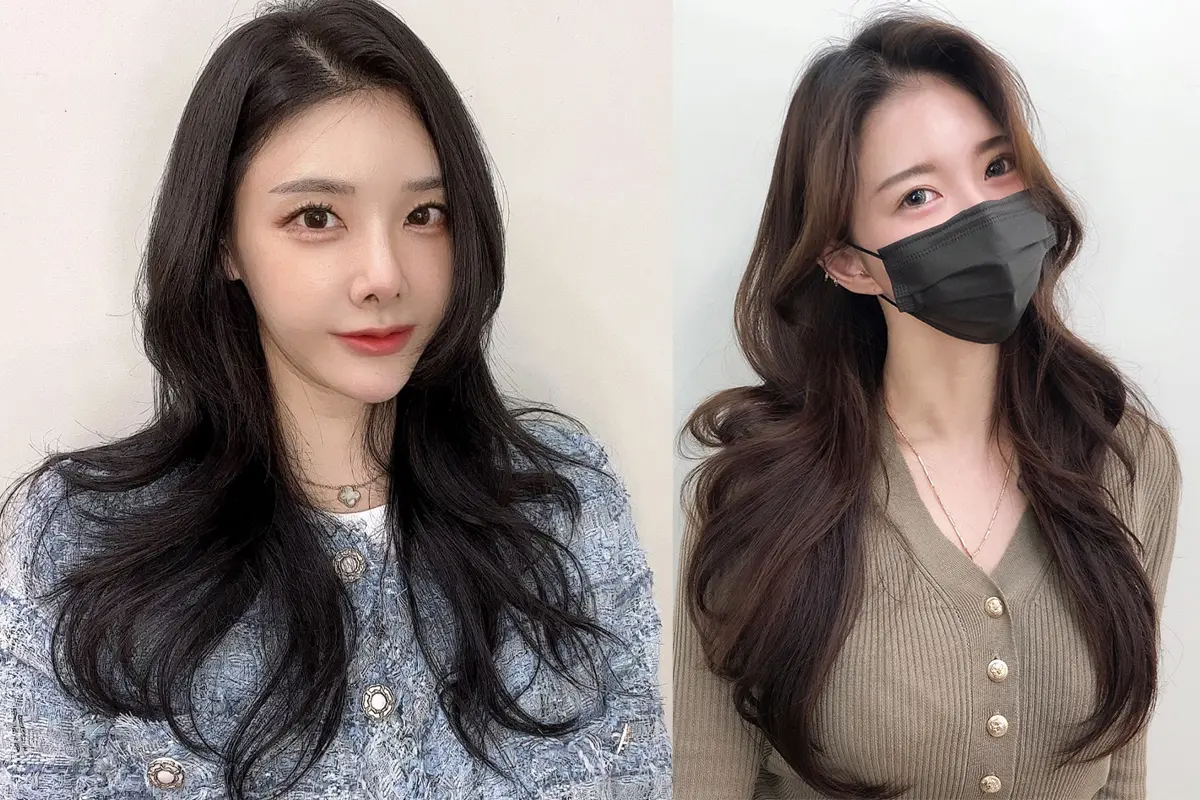 黒髪の波打つレイヤードスタイルとブラウンのロングヘアを持つモデルの写真。韓国のトレンドを取り入れたRAVI HAIRサロンのヘアスタイル。