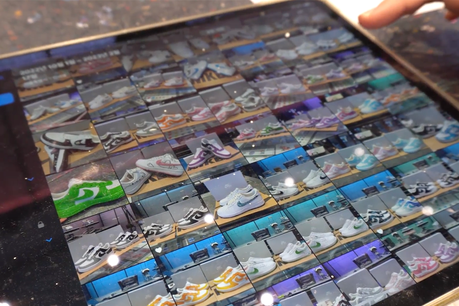 Tablet showcasing various Nike shoe styles and color options available for customization