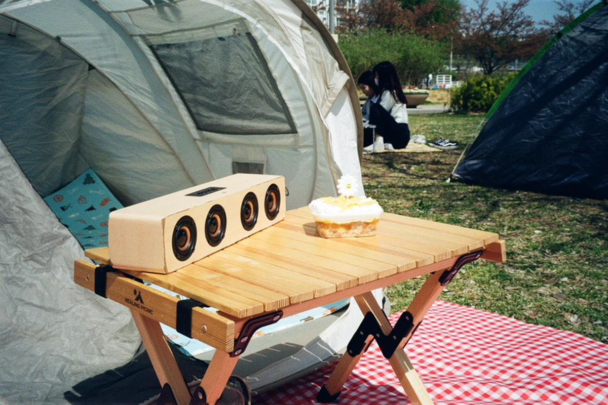 Opened tent with a picnic mat and accessories for a laid-back afternoon by the Han River.