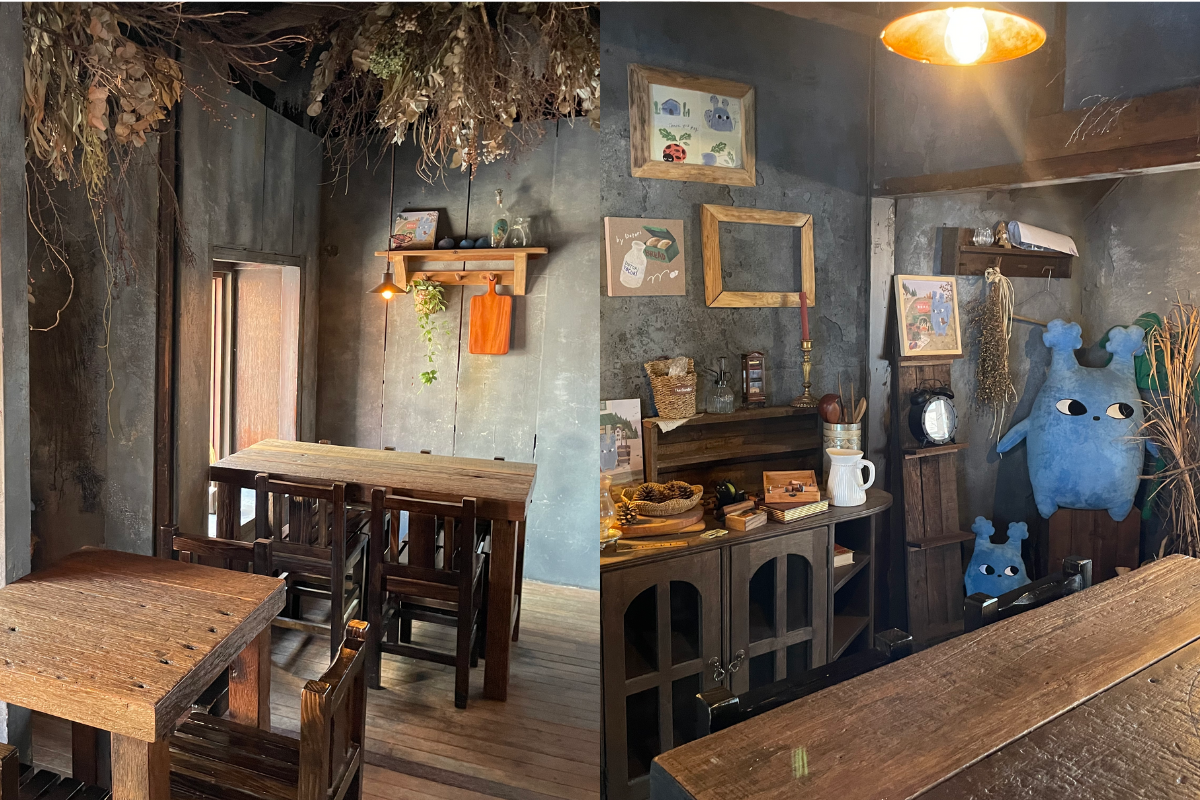 Gemütlich eingerichtetes Dotori Café-Interieur mit Holzmöbeln und dekorativen Elementen.