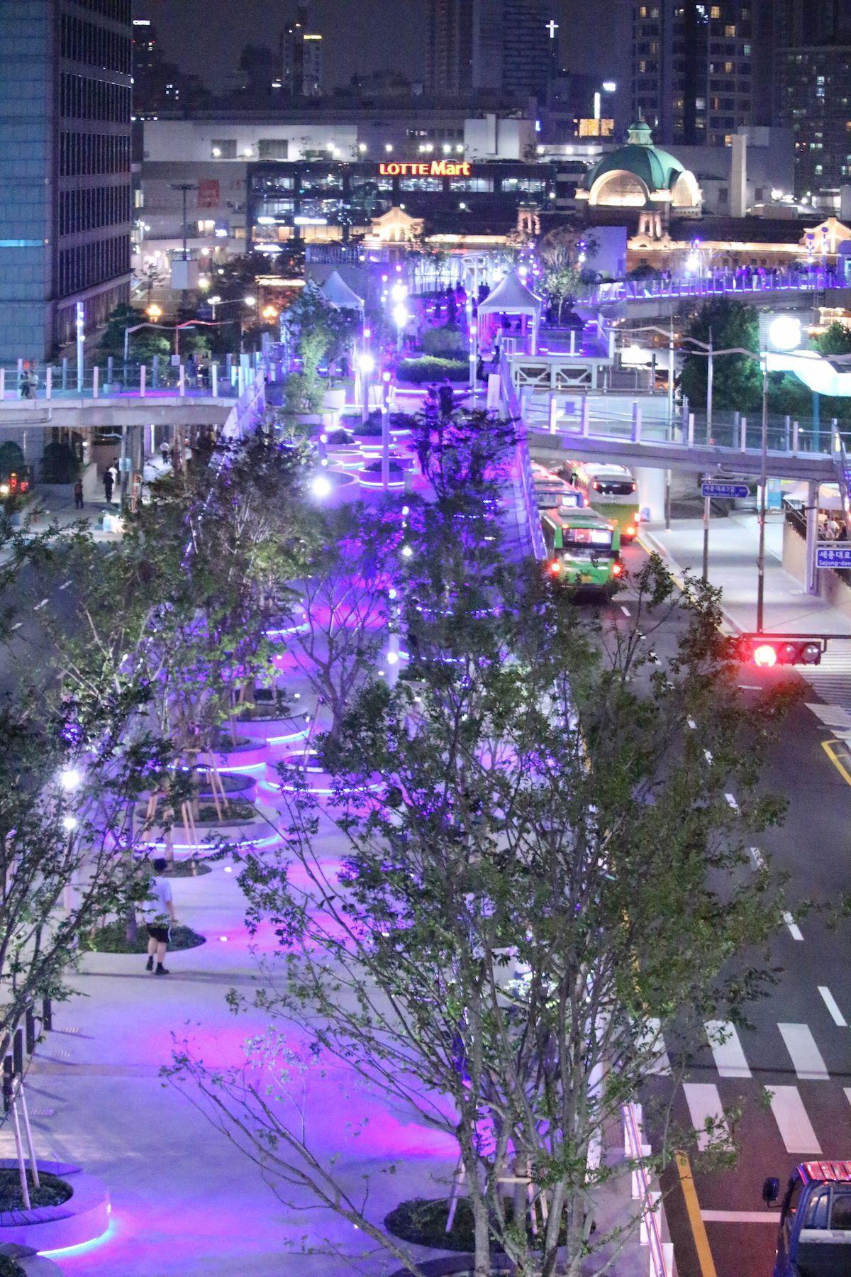 Seoullo 7017 at night, adorned with purple lighting, offering a serene nightlife experience in Seoul.