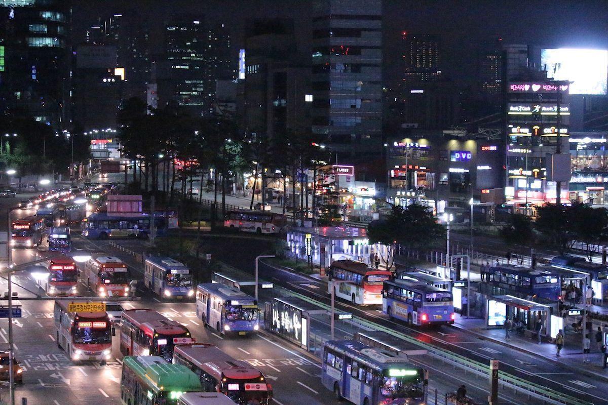 Night view near Seoullo 7017 featuring busy streets and Seoul Station, capturing the essence of Seoul's urban life.
