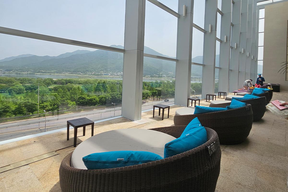 Scenic view from Aqua Field indoor pool overlooking lush forest and mountains