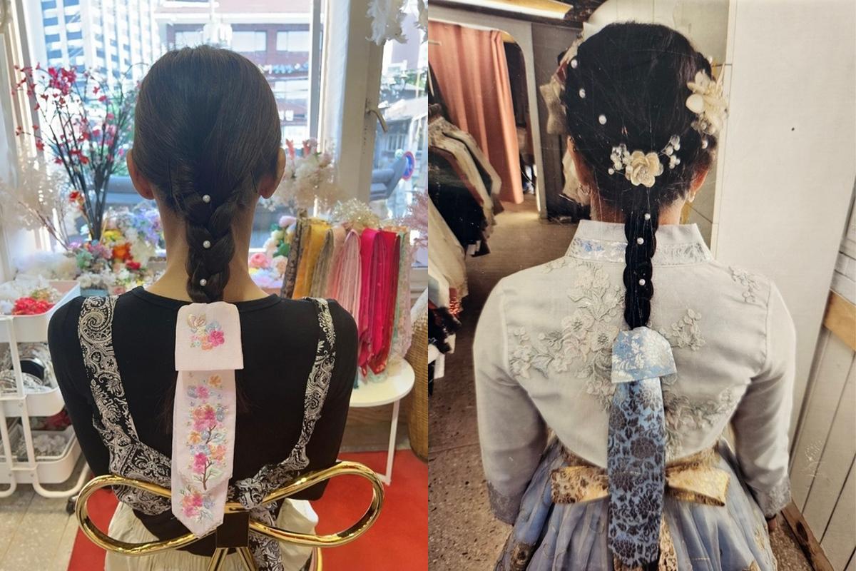 Braided hair styles adorned with floral and pearl accessories from the back, showcasing the detailed decoration available for hanbok wearers.
