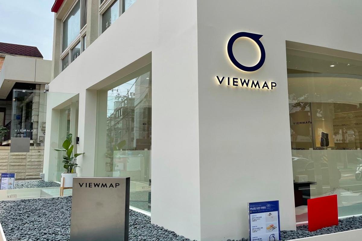 Exterior of VIEWMAP store seen from across the crosswalk.