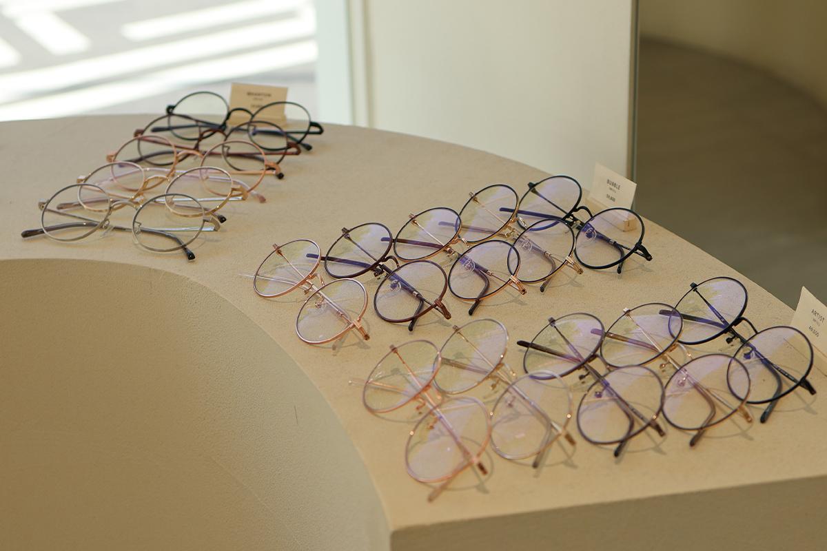 Close-up of stylish eyeglass frames on display inside VIEWMAP.