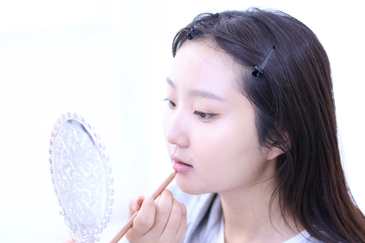 Another step in the makeup application, contributing to a polished and professional look.