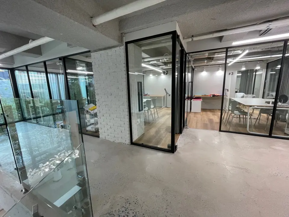 Personal color analysis room at The Bom in Myeongdong with multiple consultation rooms equipped with glass doors to provide expert color matching services.